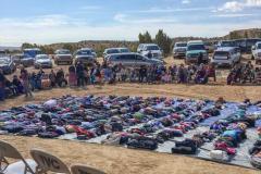 Elderly Navajos, age 75 and over, wait in a circle to receive packages of food, yarn, food and firewood certificates, clothing and a hot lunch on the Navajo Reservation at Big Mountain. 